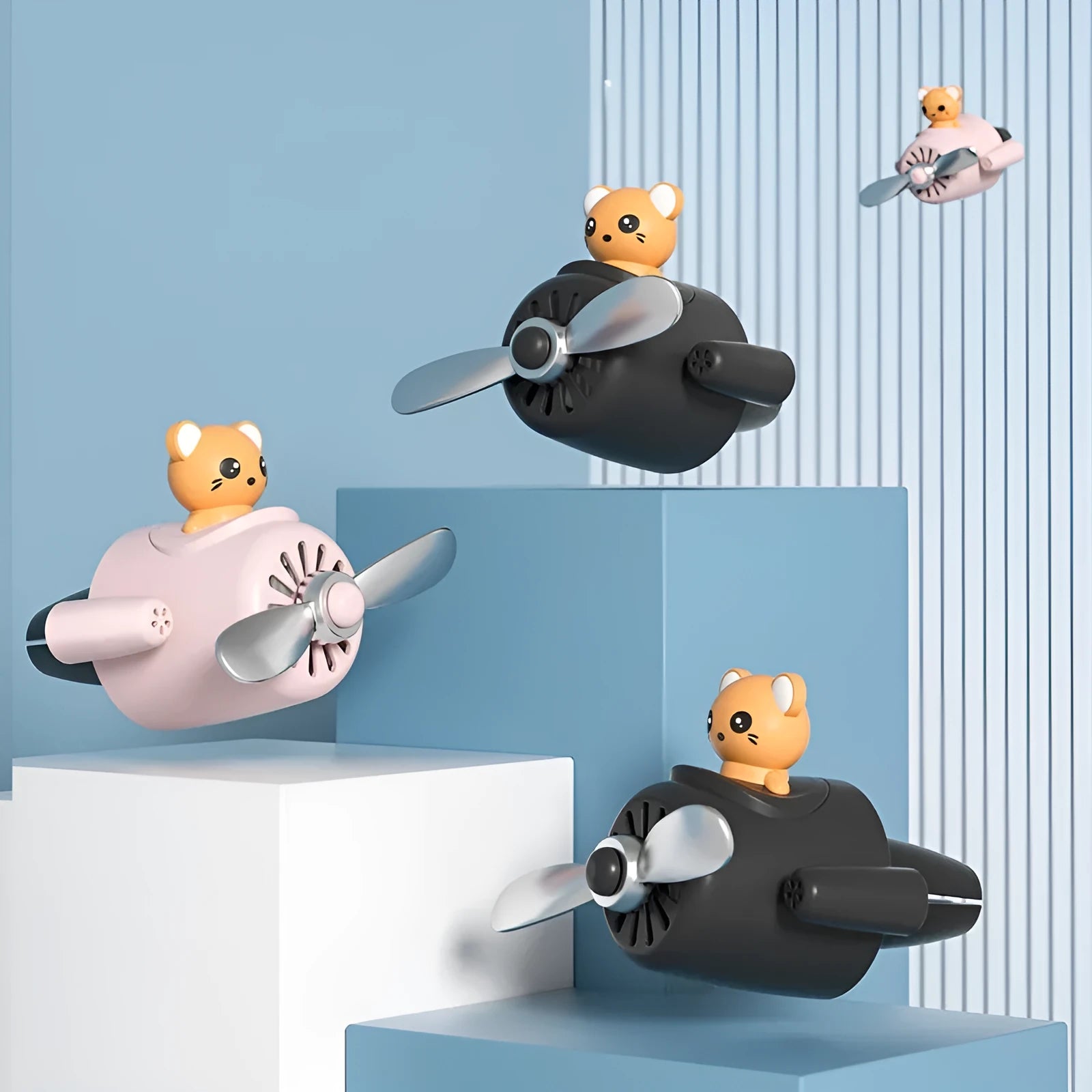 Cartoon aeroplane-shaped plastic car air vent aromatherapy diffuser with rotating fan blades.