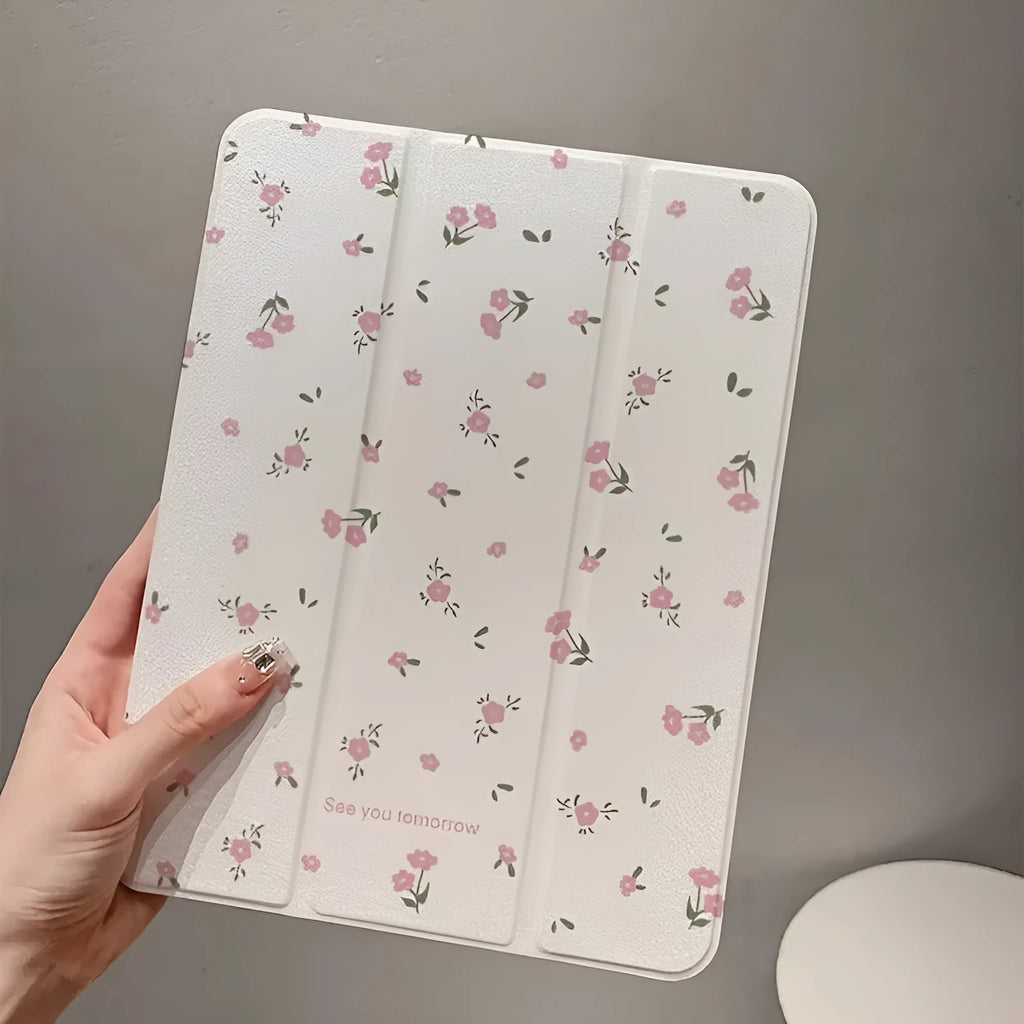 Transparent floral patterned iPad case folded into standing position showing magnetic closure and port cutouts