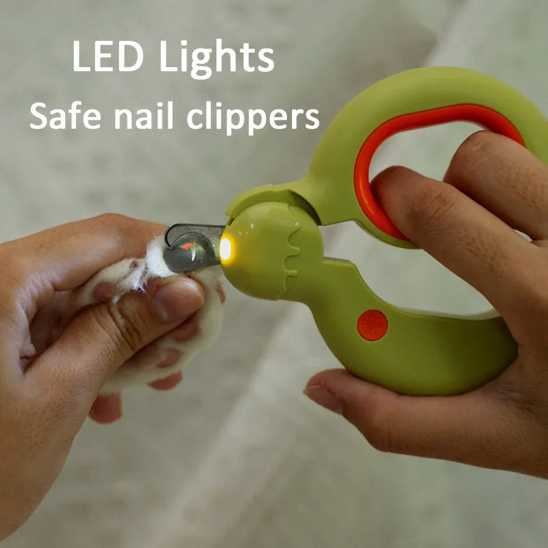 Blue pet nail clippers with LED light on, showing stainless steel blades and ergonomic handle.