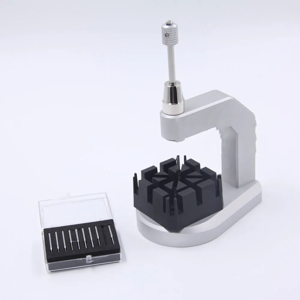 Silver multi-purpose press strap removal tool with a tool steel blade for watch and jewellery repair.