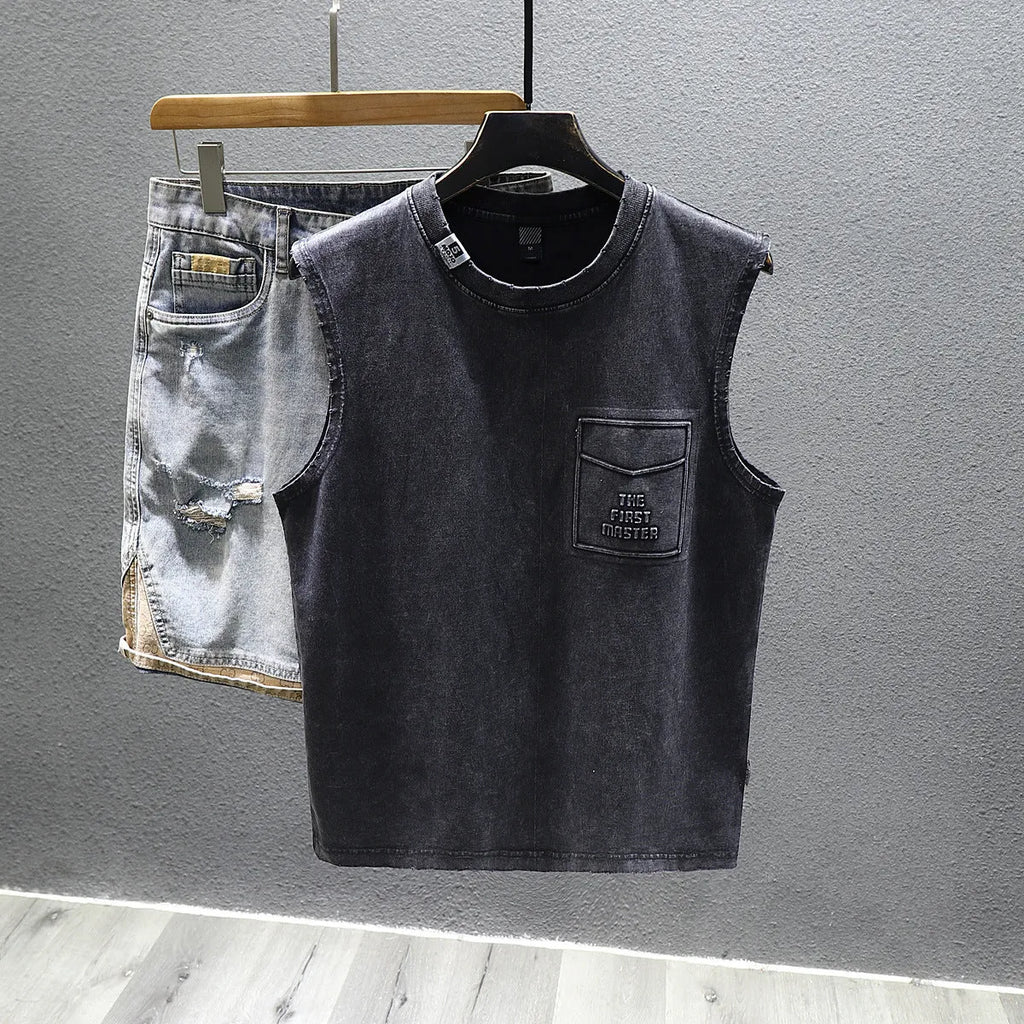 Men's solid black cotton sleeveless t-shirt with loose fit and straight hem on a white background.