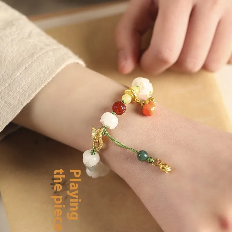 White jade bodhi bracelet with lotus and pumpkin beads on open rope