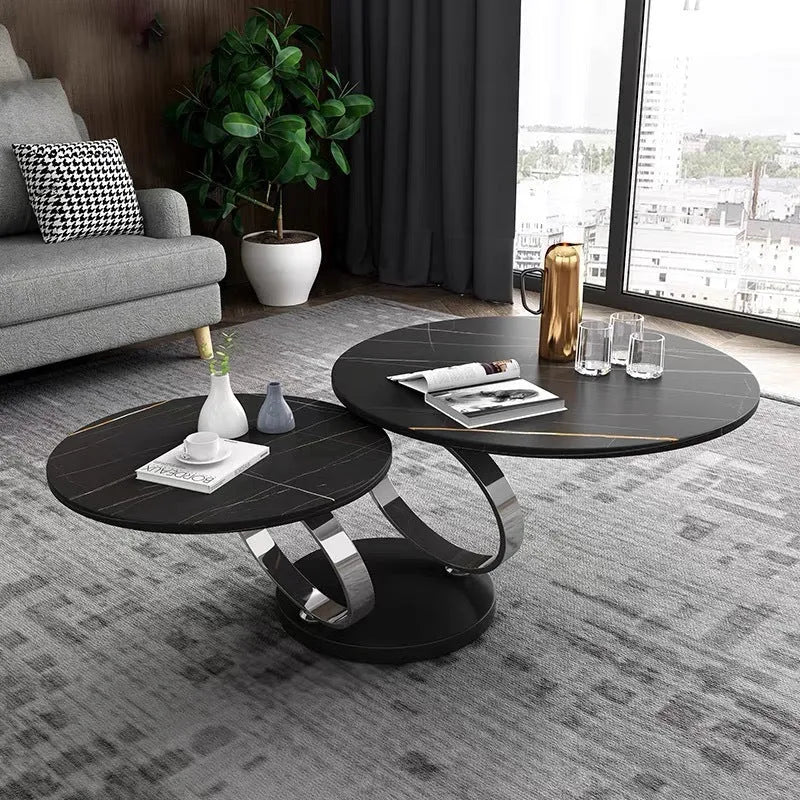 Round rotary folding table with slate top in black and white, set in a living room