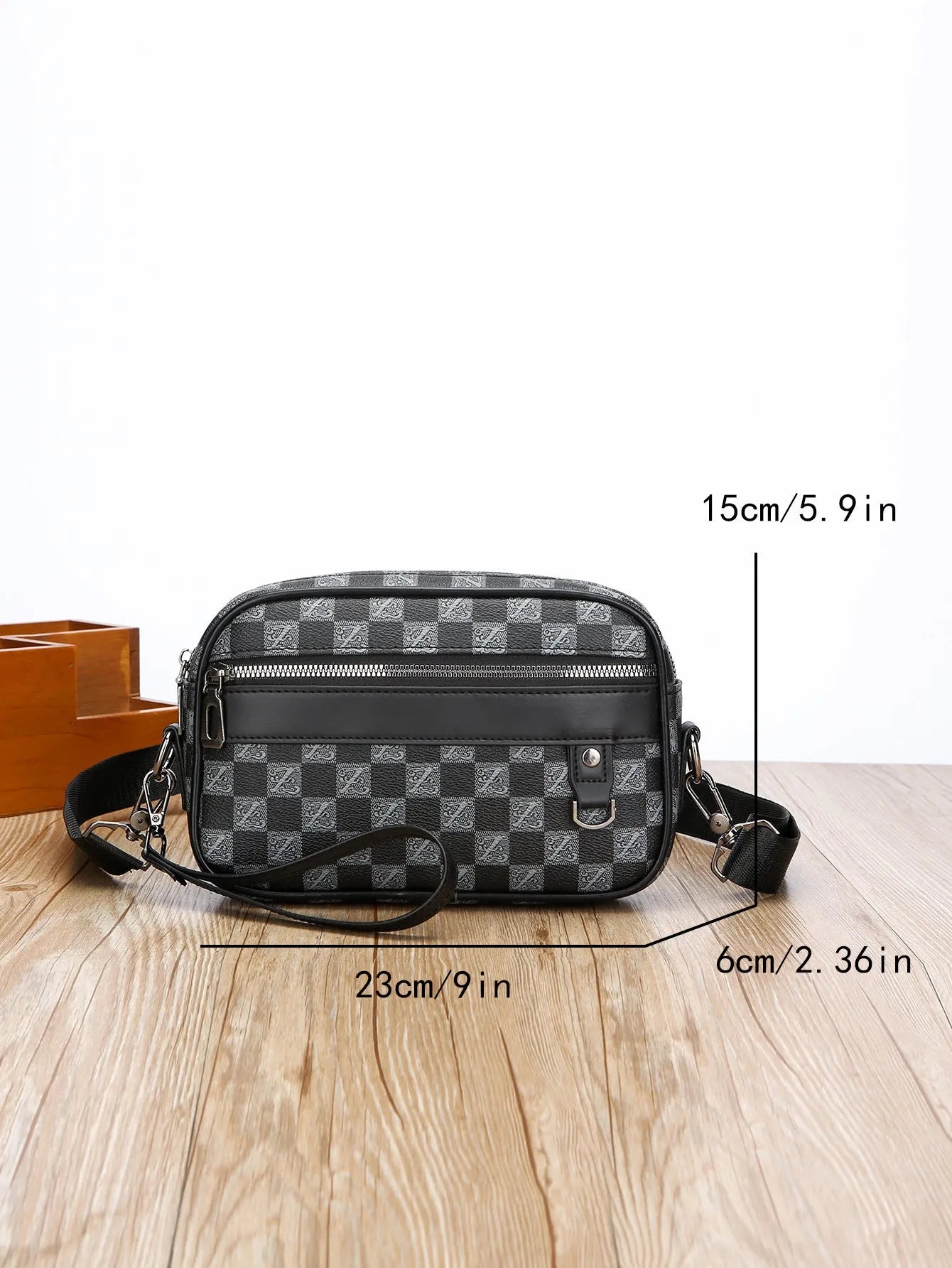 Men's black PU leather messenger bag with geometric pattern lining and shoulder strap