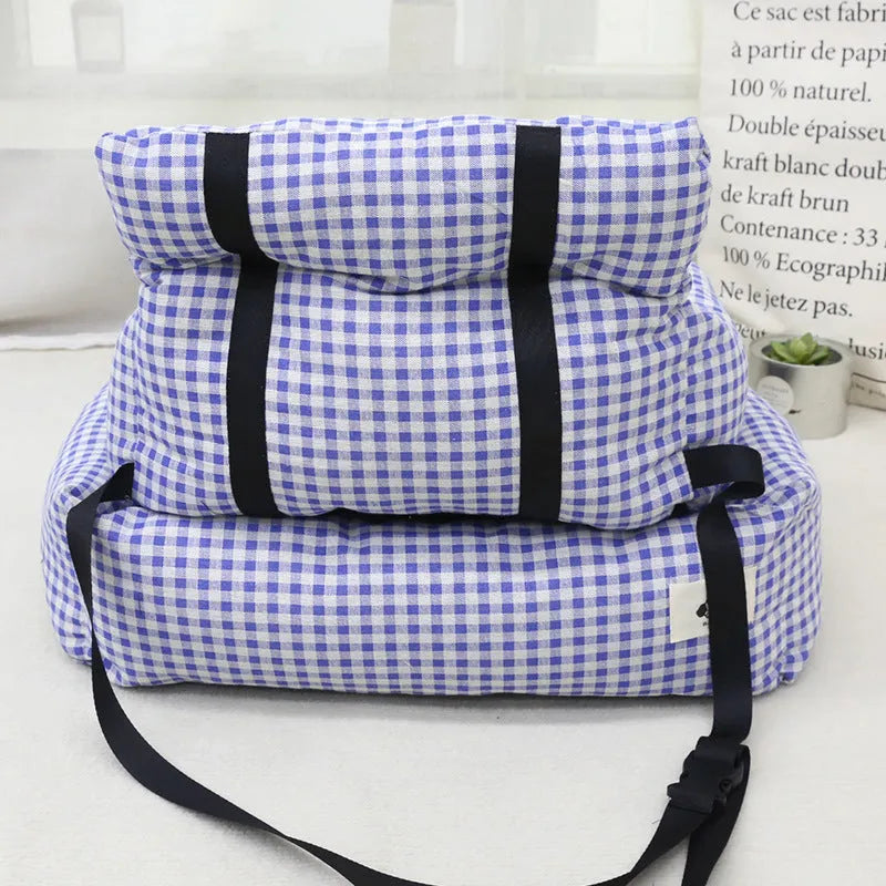Grey and blue plaid washable fabric dog travel nest for car use, shown in two sizes.