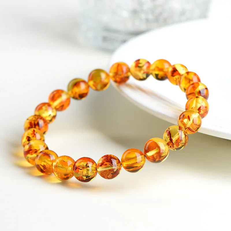 Natural yellow piebald amber bracelet with geometric polished beads.