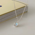 Silver geometric stone necklace on a curb chain, showing adjustable length and polished pendant.