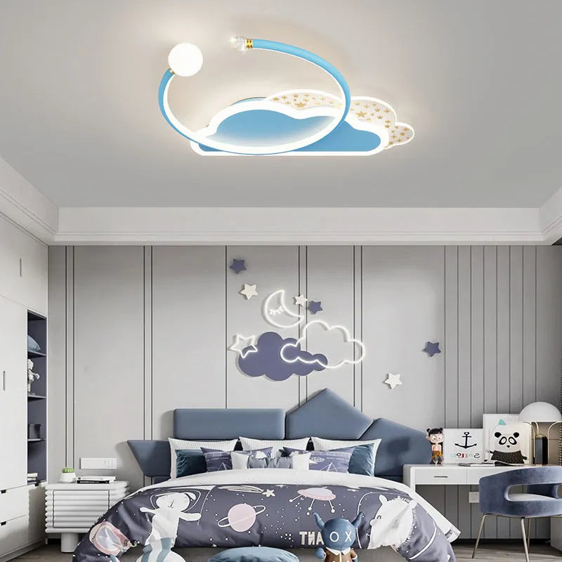 Children's room ceiling lamp with creative moon and cloud design in blue colour on a white ceiling.