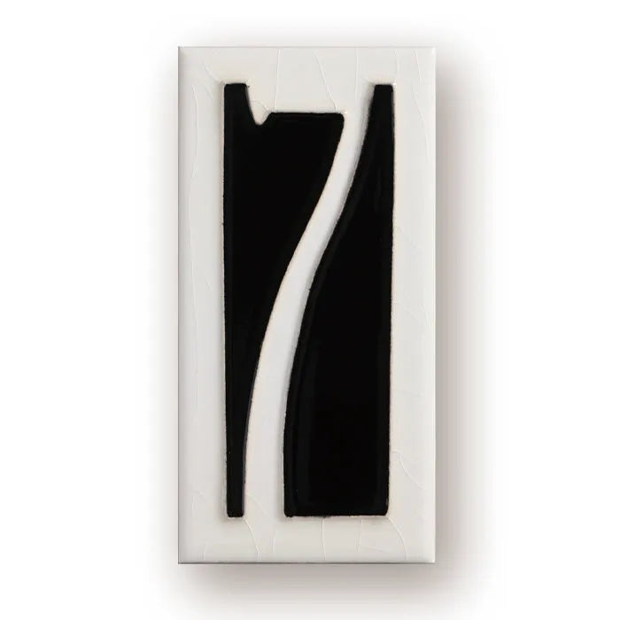 Handmade retro-style ceramic doorplate with fired enamel number, shown against a door.