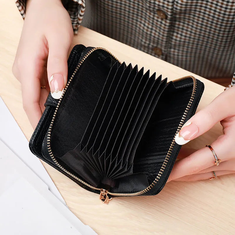 A compact beige ladies' short wallet with a textured lychee pattern, shown folded.