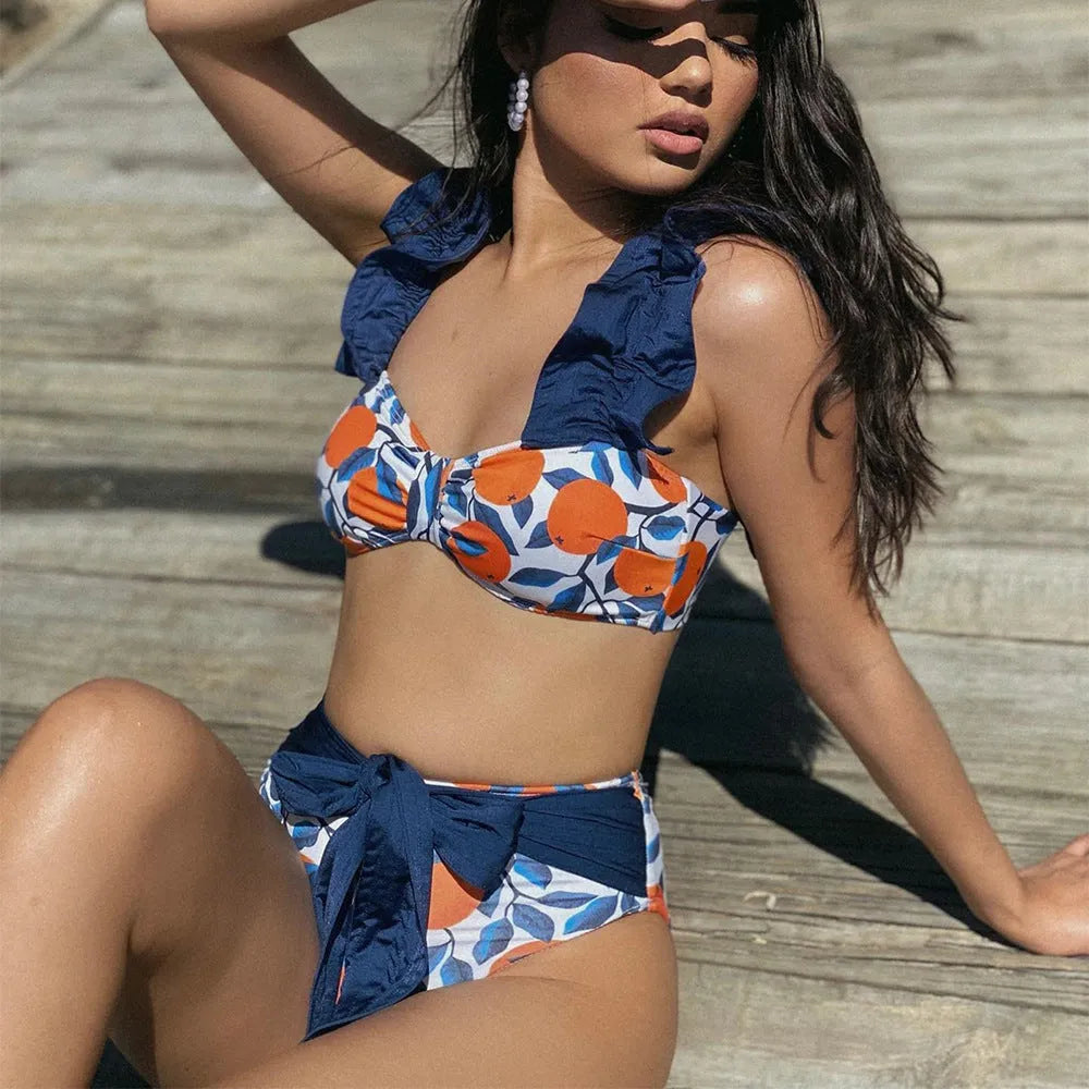 Women's high waisted bikini swimsuit with blue leaf orange floral print on polyester fabric