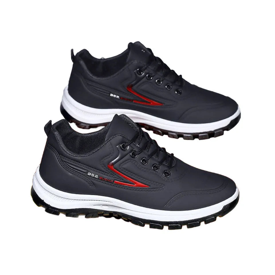 Men's black and grey waterproof PU casual shoes with a pointed toe and flat plastic sole on a white background.