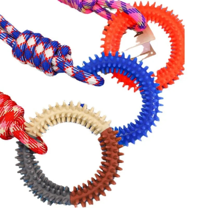 Long blue braided rope dog toy with a central knot, shown on a white background
