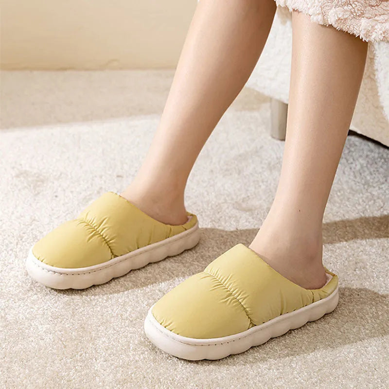 Blue down cotton winter slippers with thick rubber sole and plush lining for indoor use.