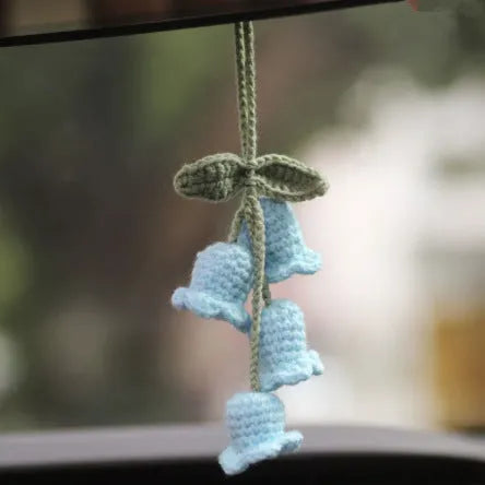 Green and white knitted wool car plant decoration with basin base and hanging rope