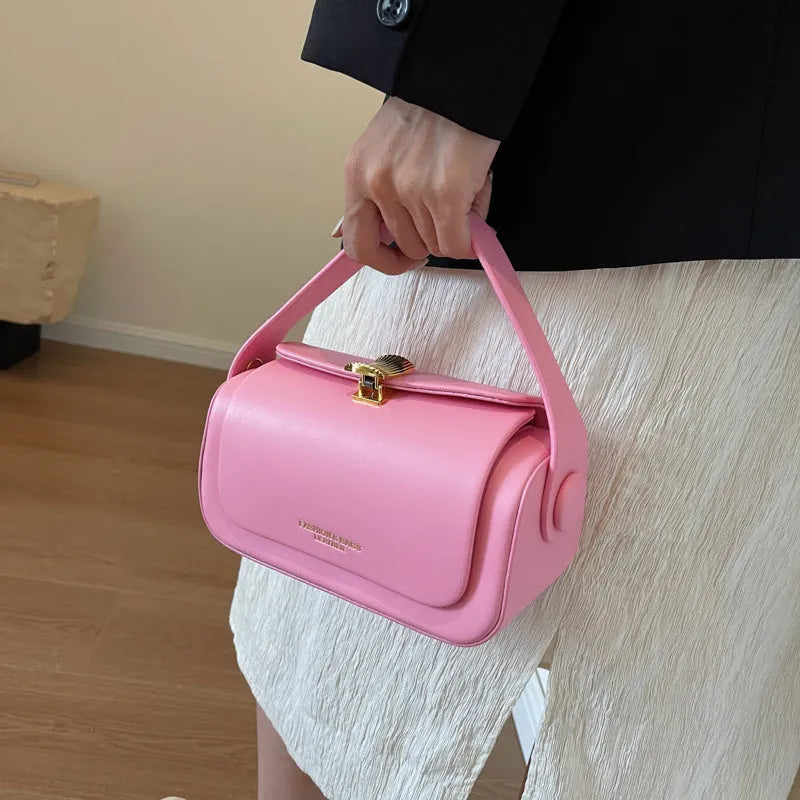 A personalised women's shoulder messenger bag in PU leather, shown in beige with letter detailing.