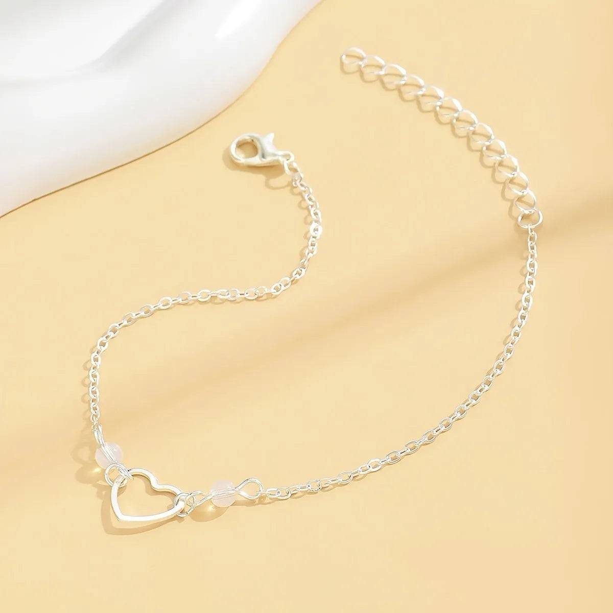 Women's gold and silver adjustable heart anklet with geometric minimalist design
