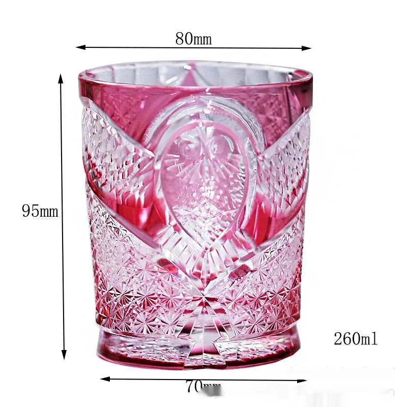 Crystal glass hand carved golden red owl wine glass with 201-300ml capacity on a table
