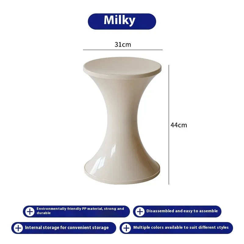 A plastic hourglass-style shoe changing stool, shown in one of the available colours.
