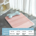 Pink dog cooling mat with ice bean fabric and mesh construction on a light background