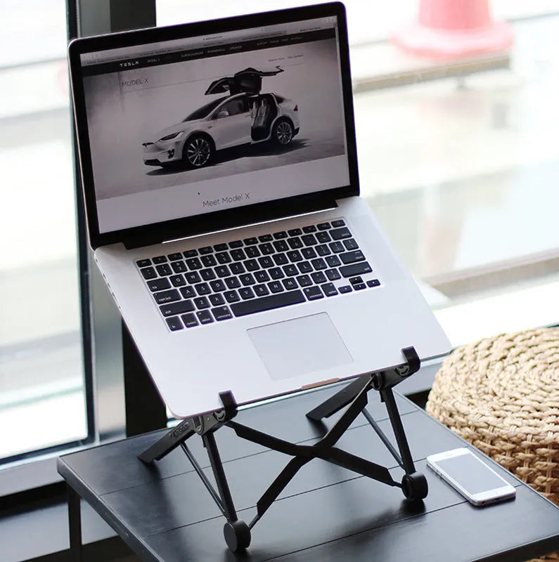 Black K2 portable foldable laptop stand made of enhanced nylon with carry bag.
