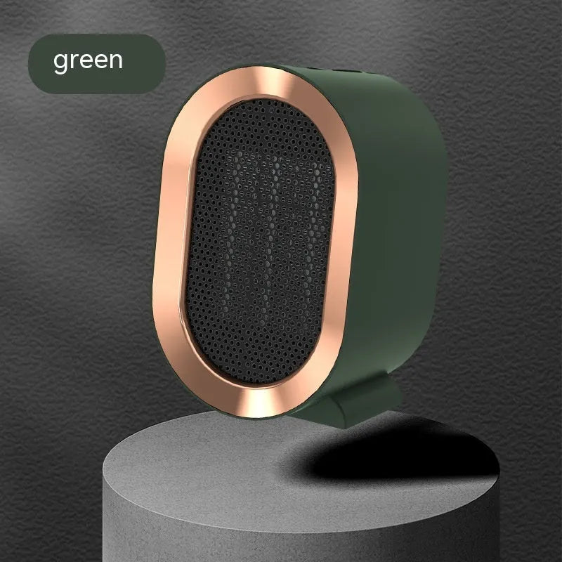 Compact black desktop electric fan heater with a front grille and mechanical control dials.