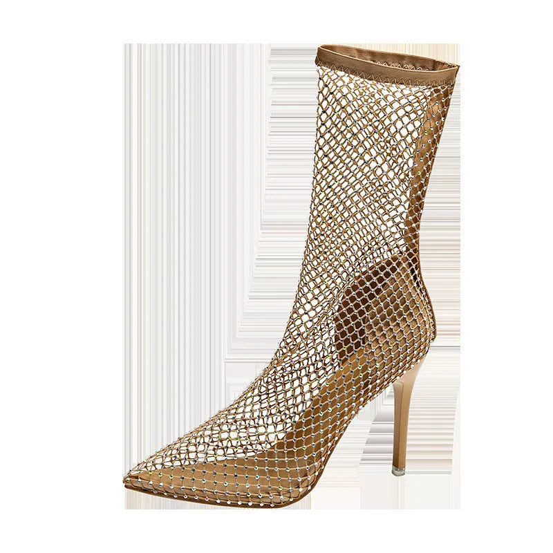 Gold high heel sandals with a mesh upper and pointed stiletto design on a rubber sole.