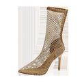 Gold high heel sandals with a mesh upper and pointed stiletto design on a rubber sole.