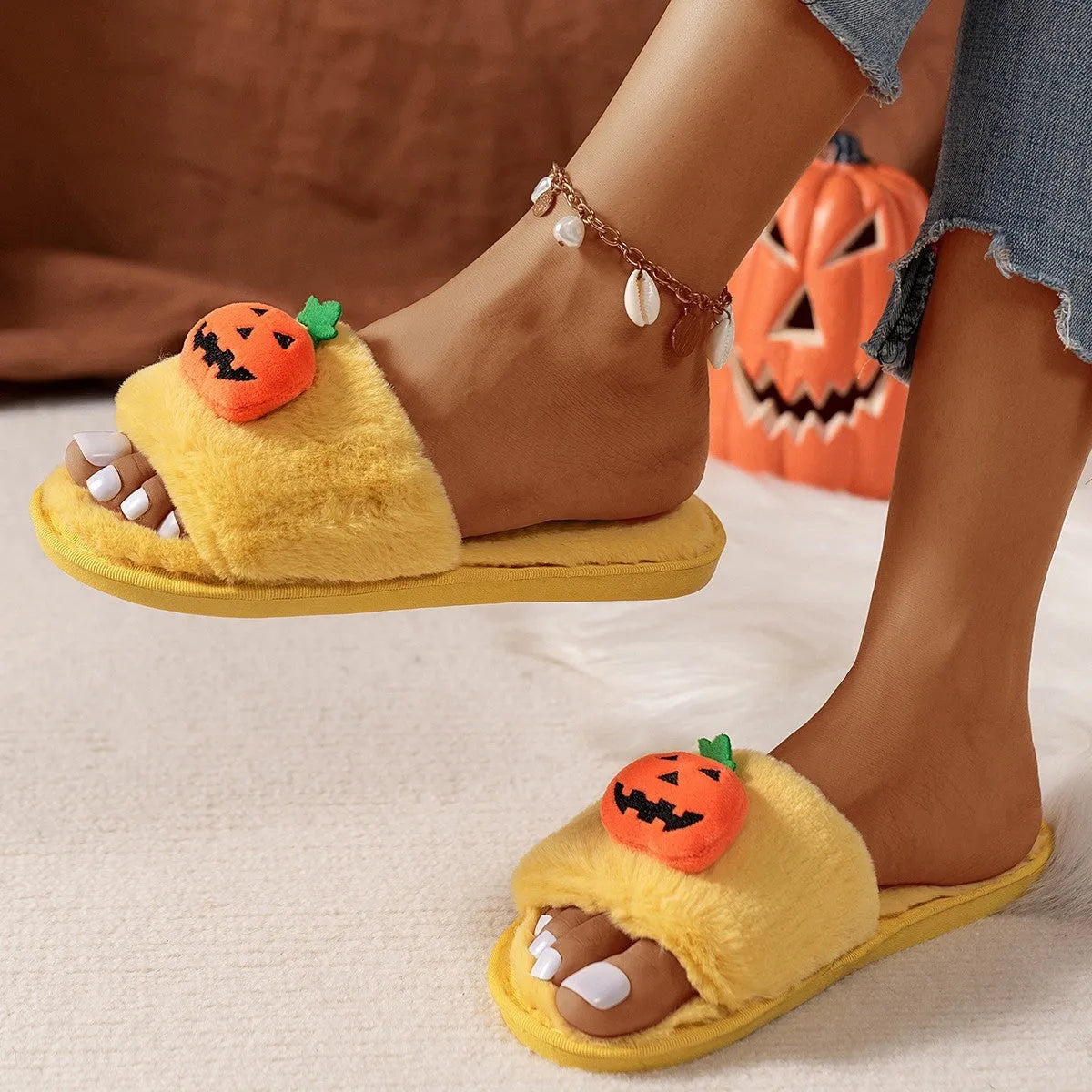 Open toe pumpkin plush slippers in synthetic fur with cartoon design and PVC soles