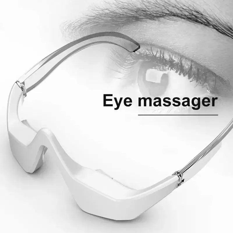 Pink and white 3D micro-current eye massager with glasses-style design on a grey background.