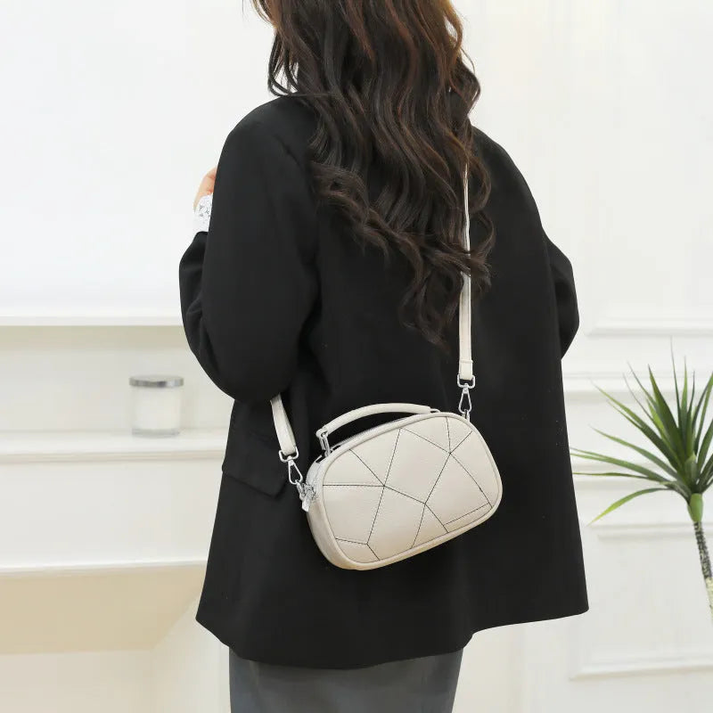 Round grey retro patchwork PU leather crossbody bag with stitching details