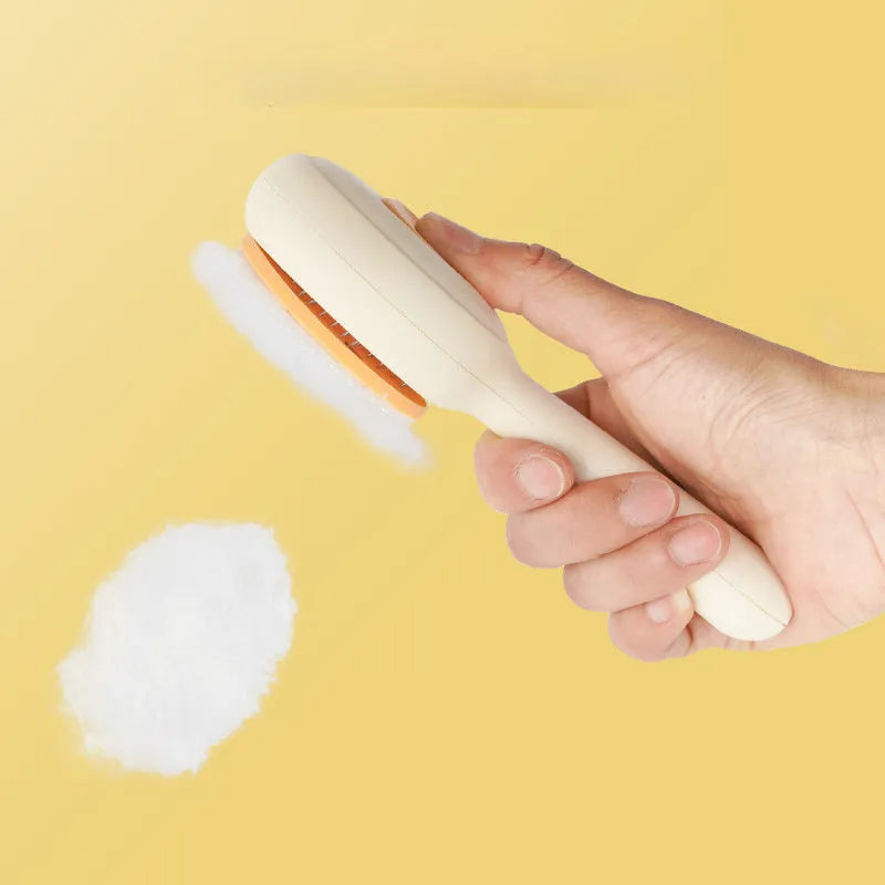 Green and yellow pet grooming brush with stainless steel teeth and a non-slip handle.