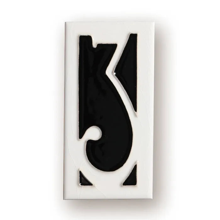 Handmade retro-style ceramic doorplate with fired enamel number, shown against a door.