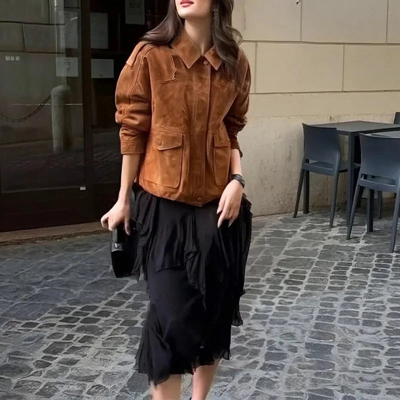 Bright brown suede-effect women's coat with regular sleeves on a hanger
