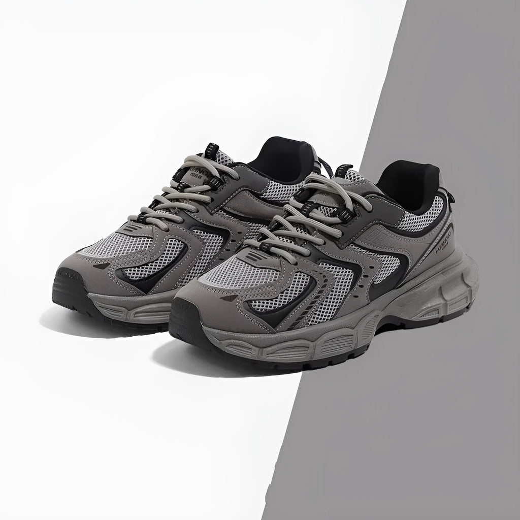 Men's gray platform casual sneakers with PU mesh upper and leather stitching details on a white background.