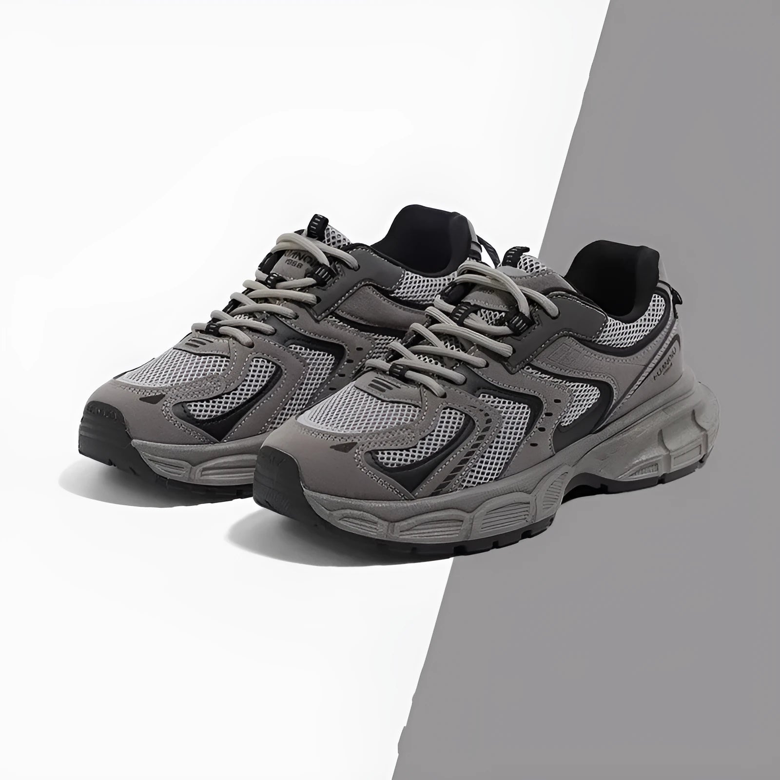 Men's gray platform casual sneakers with PU mesh upper and leather stitching details on a white background.