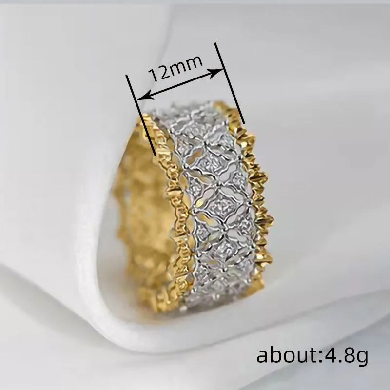 Geometric two-tone copper ring with gold electroplating and a round zircon stone.