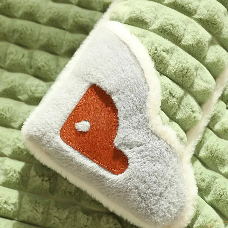 Large grey fleece dog mat with removable cover shown in a dog crate.