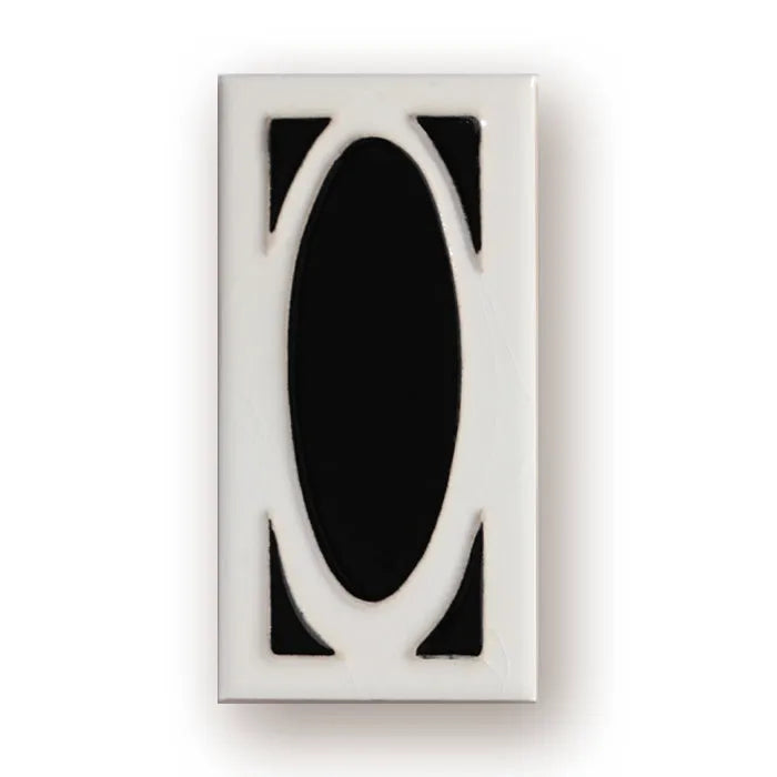 Handmade retro-style ceramic doorplate with fired enamel number, shown against a door.