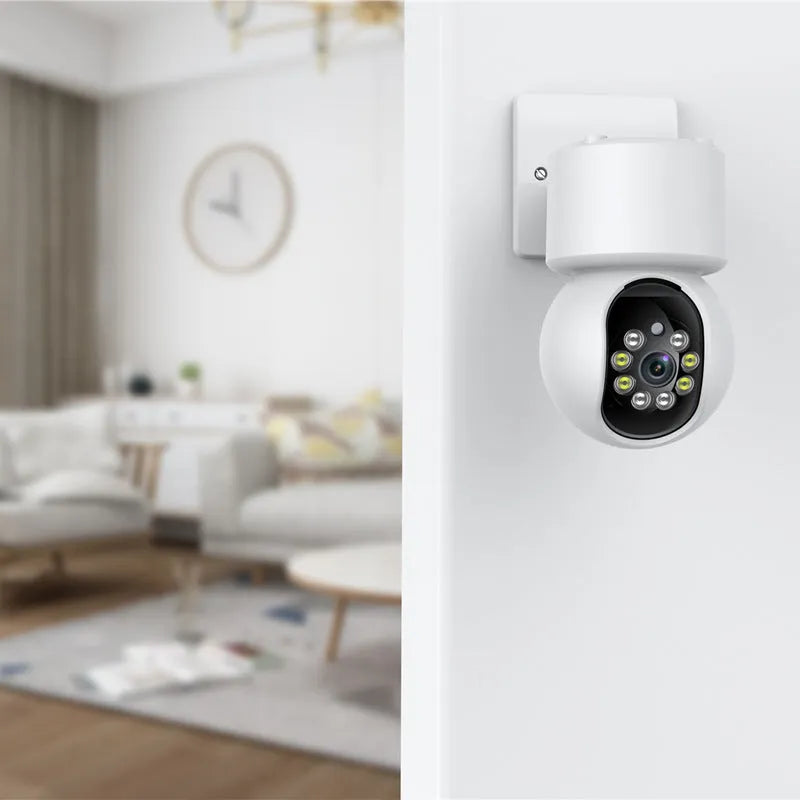 White wireless indoor 360-degree smart security camera on a stand for home monitoring.