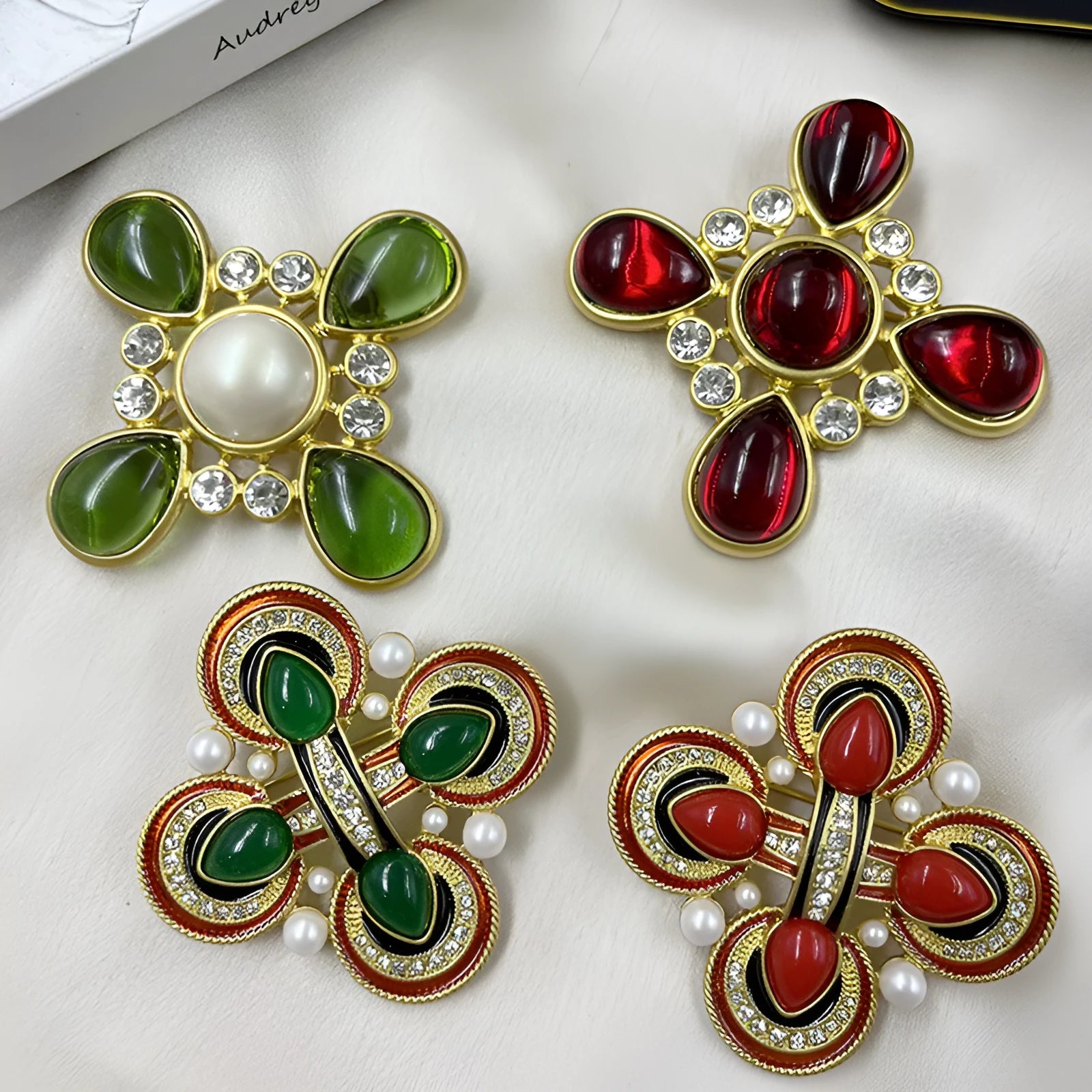 Close-up of vintage medieval baroque cross brooch with crystal accents on zinc alloy.