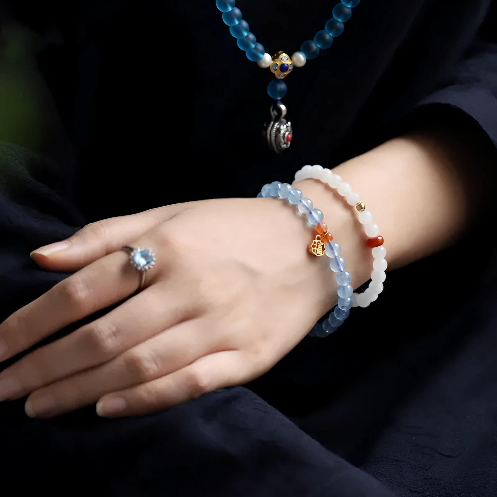 Icy translucent aquamarine crystal bead bracelet with sequin charm and blessing card.