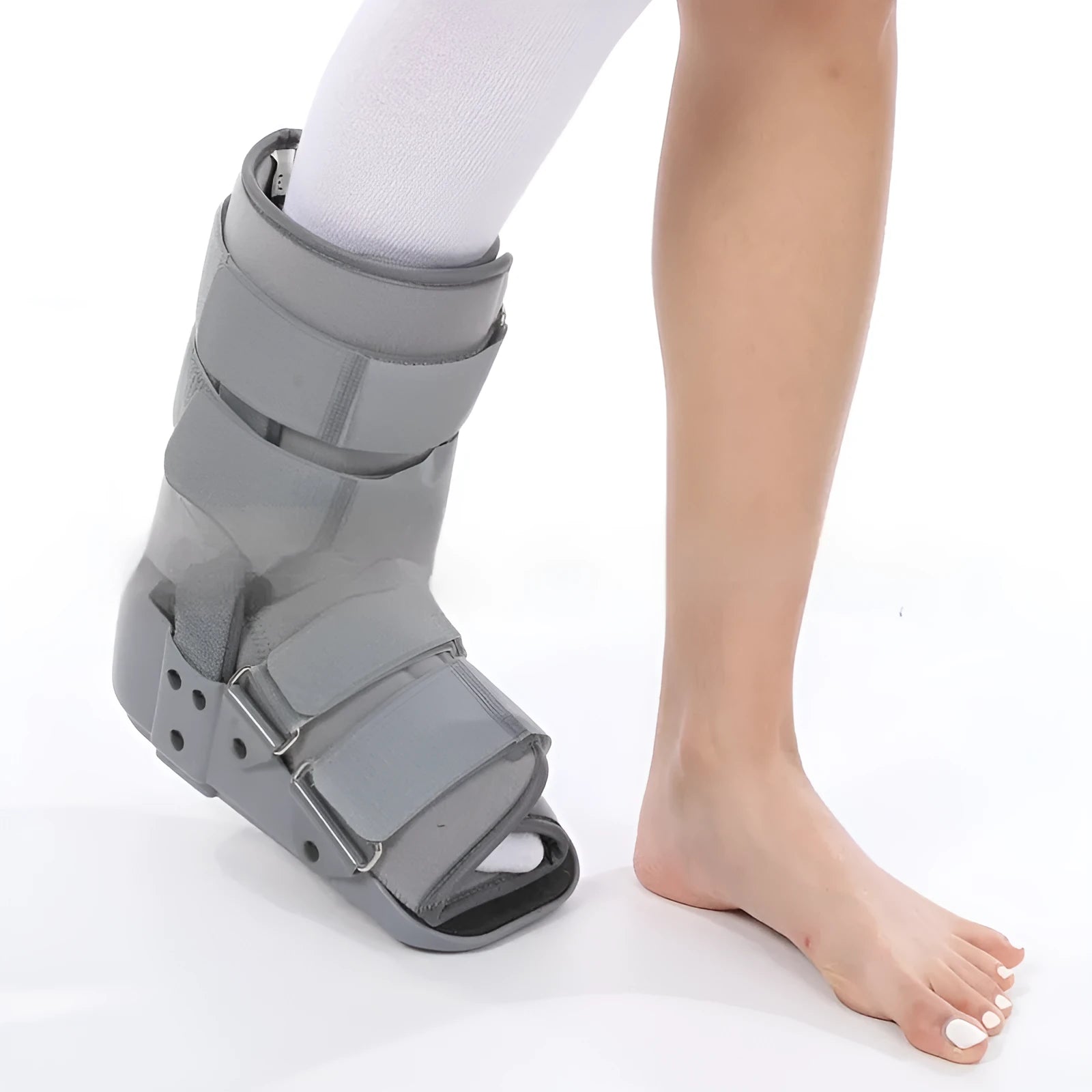 Grey Achilles tendon rehabilitation boot with fixed support and walking shoe sole.