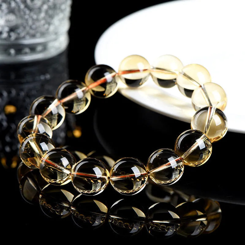 Original design natural citrine scattered beads ball bracelet showing polished yellow stones in a textured arrangement.