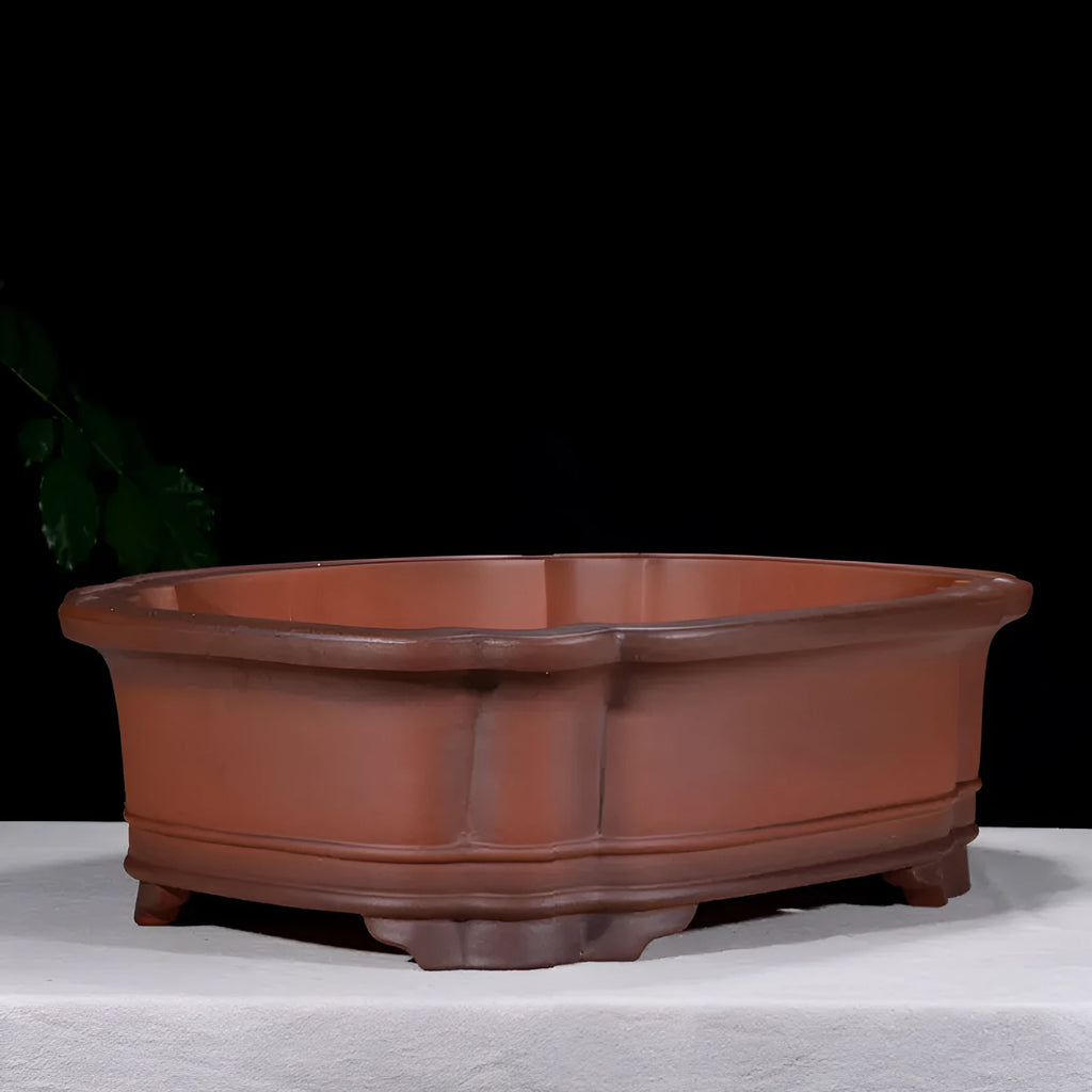 Large antique finish purple clay rectangular flowerpot with carved Chinese tree stump, pine, cypress, and fruit designs.