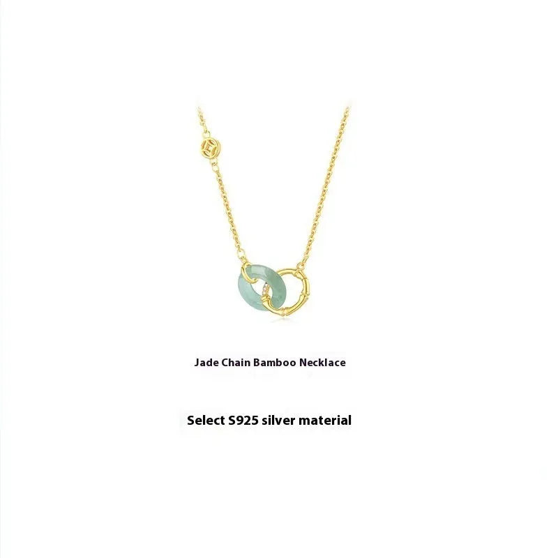 Sterling silver bamboo buckle necklace on geometric O-ring chain, showing adjustable length and pearl detail.