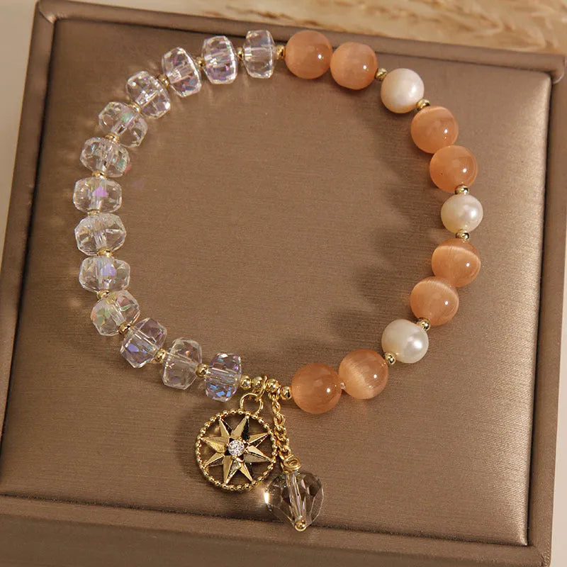 Orange Eight Awn Star bracelet with gold-plated setting and opal crystal inlay