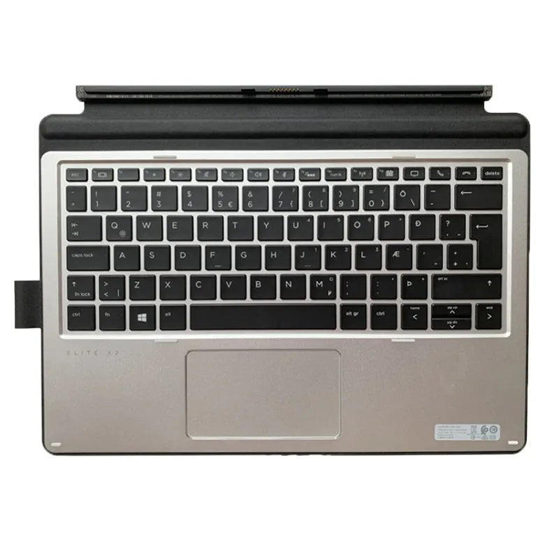 Elite X2 tablet sitting in the integrated base of a wireless keyboard with multimedia keys.