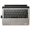 Elite X2 tablet sitting in the integrated base of a wireless keyboard with multimedia keys.