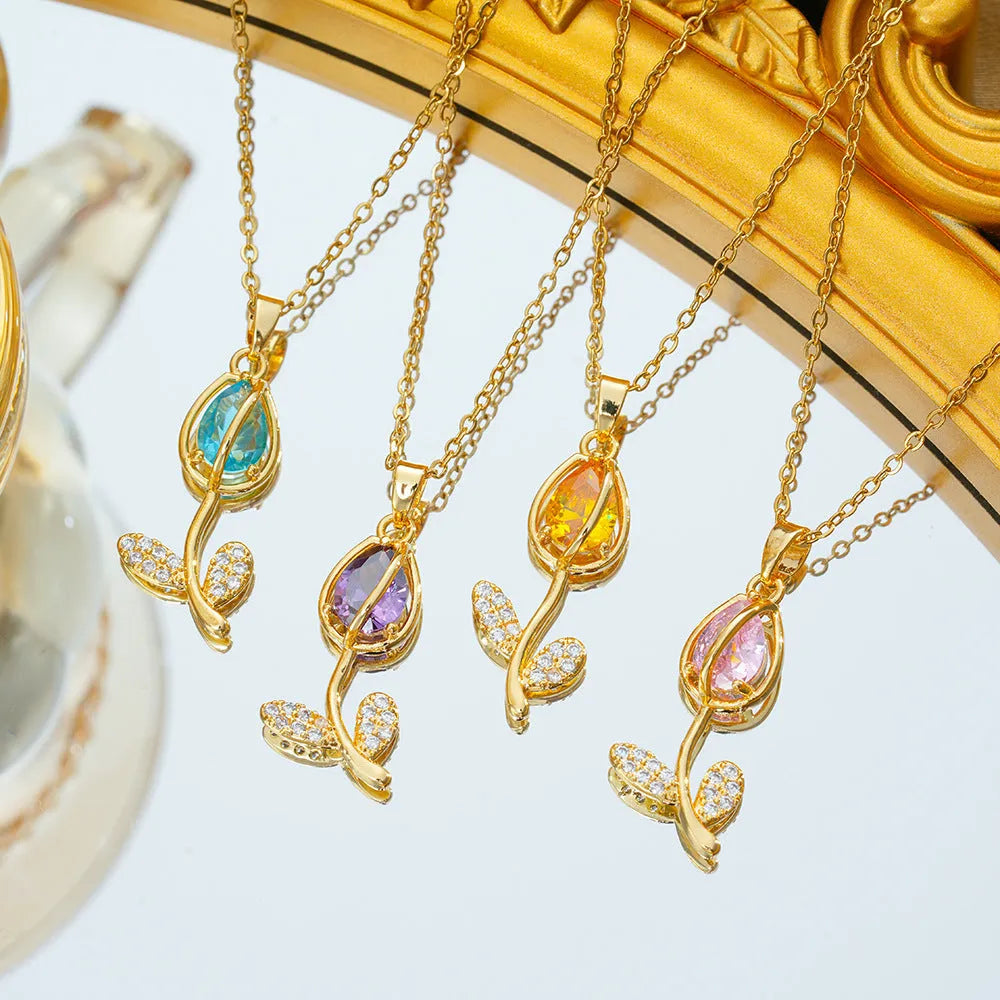 Gold tulip flower pendant necklace on an O-ring chain, showing adjustable length from 41cm to 50cm.